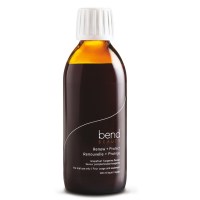 An amber bottle with white screw top lid with Bend Beauty Renew + Protect Liquid Formula.